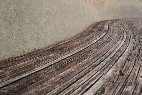 Find a photograph of a wood and concrete bench for sale.