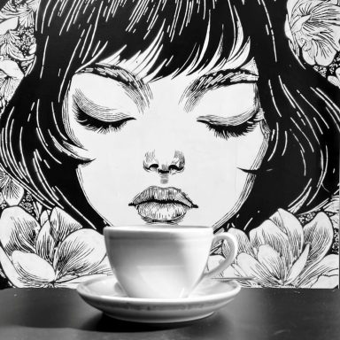 Coffee shop mural of girl with cup of coffee.