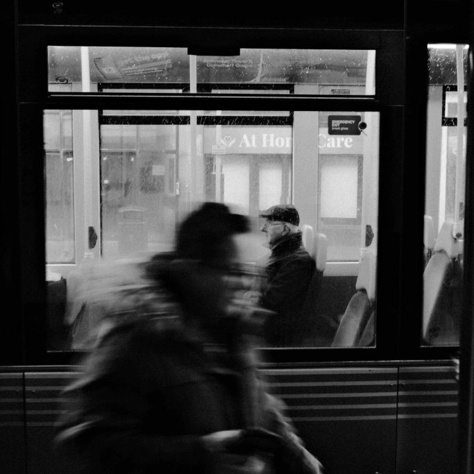 Going home Black and white photograph of an elderly man travelling home on a bus.