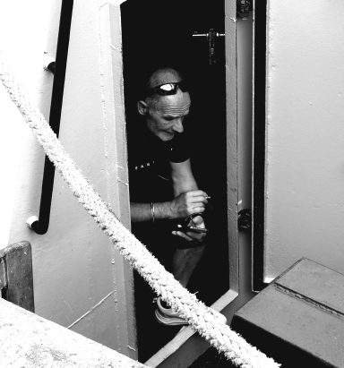 Find a photograph of a trawlerman taking a break